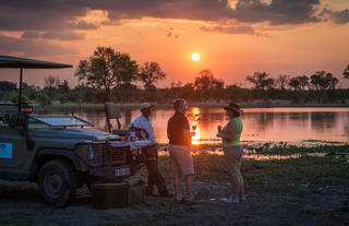 Sundowners on Safari at Machaba Camp