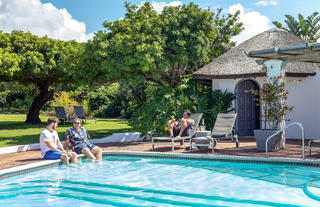 Guests relaxing at the big pool at the Lodge