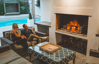The outside lounge & braai area at The Villa