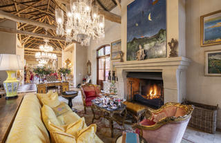 Enjoy red wine by the crackling fireplace