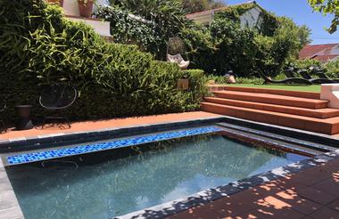 The pool, egg chairs and lounging deck