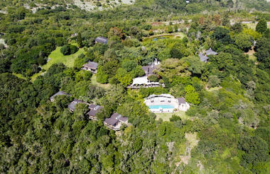 Layout of lodge , main building and rooms in surrounding forest