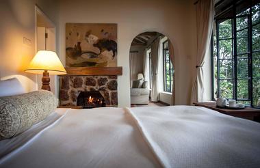 Cozy fireside bed in the Clouds cottages
