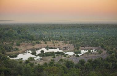 View from the lodge deck of the waterhole early in the morning