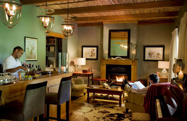 Relax by the fire, glass of wine in hand