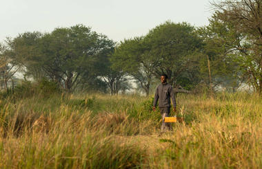 Ubuntu Camp - Staff member carrying a basket