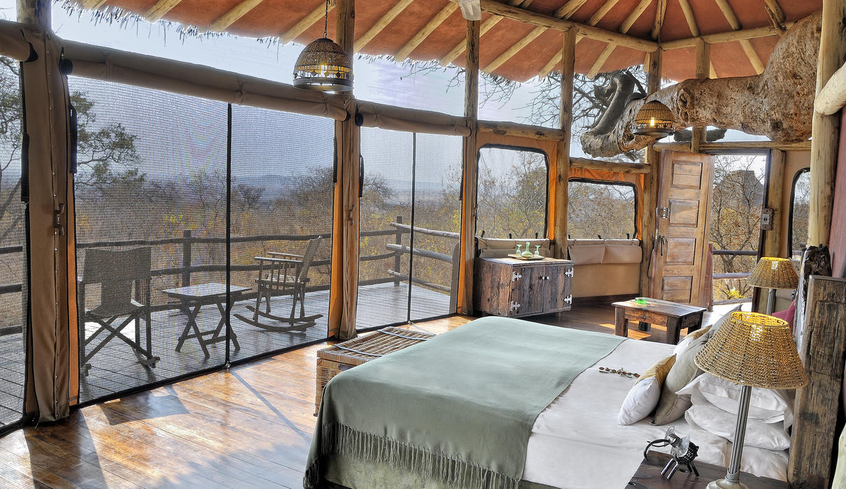 Earthy colours and natural materials decorate the interiors of the elevated treehouse suites