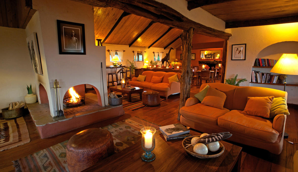Cozy main lounge and dining area with log fires