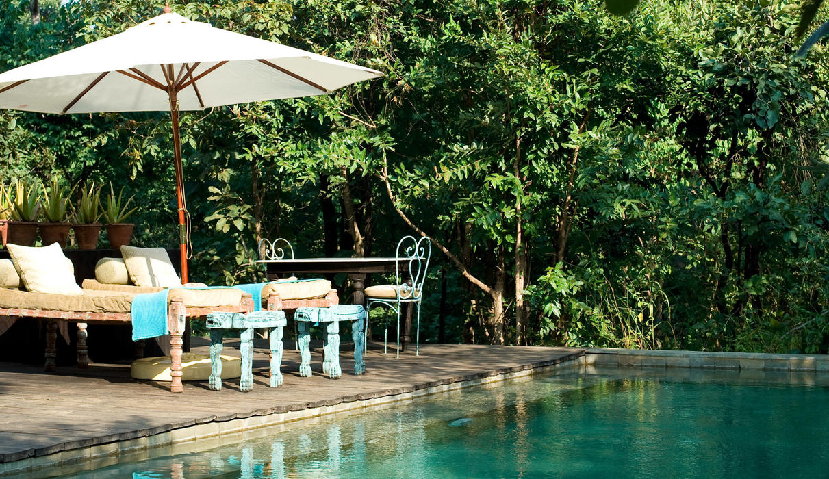 Guests can cool off in the sparkling swimming pool which contours along the nullah