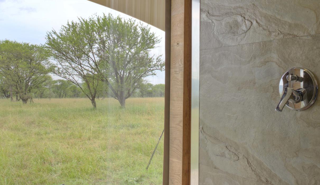 the shower area opens up to the Savannah and hot tub area