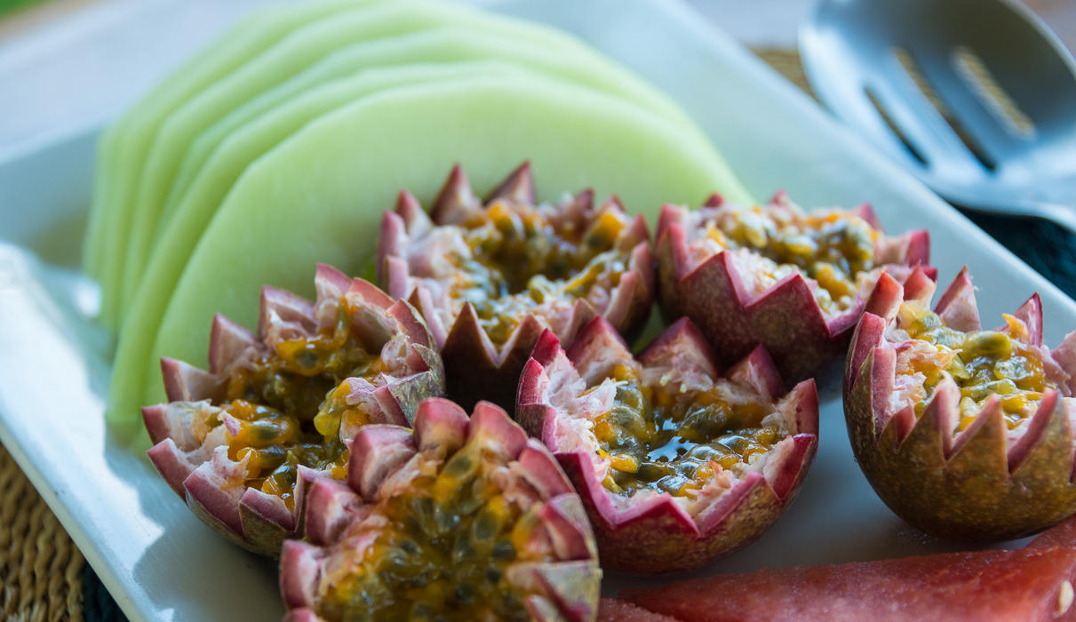 Delicious fruit salad with melon and passionfruit