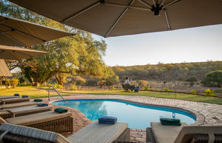 Guest pool area overlooking Victoria Falls Private Game Reserve