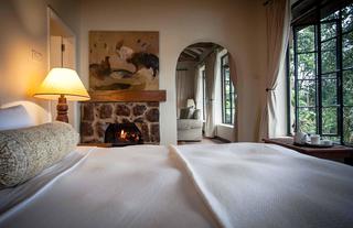 Cozy fireside bed in the Clouds cottages