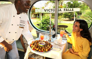 Enjoying canapes before departure from Victoria Falls Station