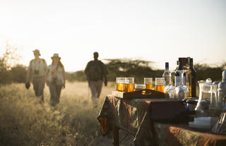 Oliver's Camp - guests reach sundowner and refreshment station after a walking safari