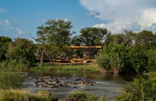 Tanzania-Grumeti-Serengeti-River-Lodge-Guest-Area-exterior-with-hippo-pod_2