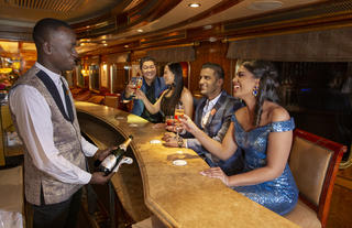 Guests being served drinks in Club Car