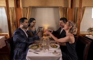 Guests enjoying dinner in the Dining Car