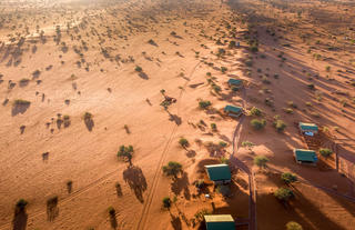 Aerial view of savanna and dune chalets