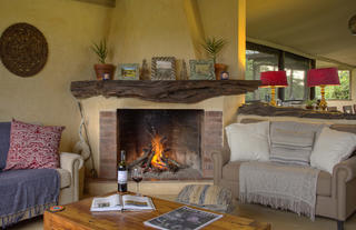 Asilia Ol Pejeta Bush Camp - Lounge Area with Fireplace