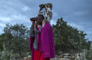 Mara House - Maasai guide with guest child