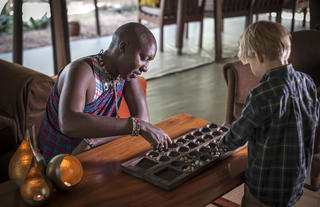 Asilia Africa | Encounter Mara - Maasai playing games with children