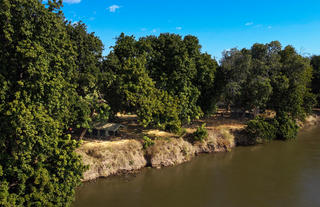Mana River Camp - Tent on River bank