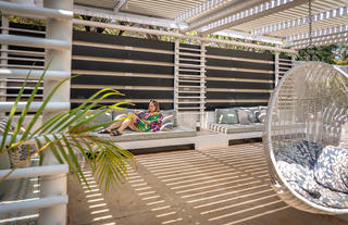 Comfortable outdoor seating area by the pool