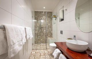 Family Room en suite bathroom with vanity and high pressure shower