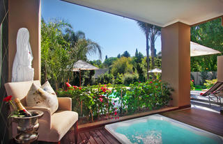 The Residence - jacuzzi overlooking the beautiful gardens.