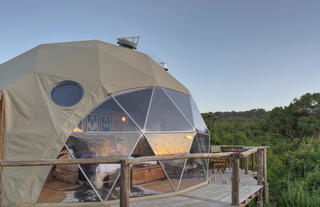 The Highlands - Exterior of Done Tent, Showing Off the Deck and Views into the Forest