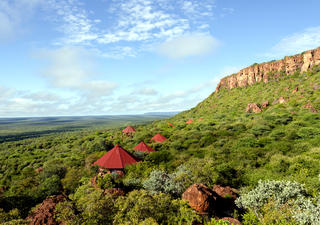 The chalets of the Waterberg Plateau Lodge are nestled in the bush on a rock terrace on the slope of the Waterberg.