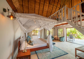 Kafunta River Lodge - Luxury suite main sleeping area and deck