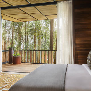 Experience an undisturbed connection with the vast forest beyond, lounging in your luxurious king-sized bedroom, sound tracked by the soothing crackle of local wood in the fireplace. Watch the floor-to-ceiling glass disappear and let the scents and sounds of nature flow in. Follow them out to your secluded open-air viewing deck, enjoy an invigorating al fresco shower or spend precious time relaxing in your standalone bath with undisturbed private views.