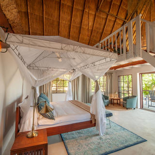 Kafunta River Lodge - Luxury suite main sleeping area and deck