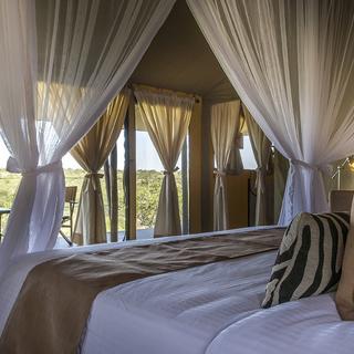 All tents with separate living room area, private balconies, in room safe, telephone and wifi  available
