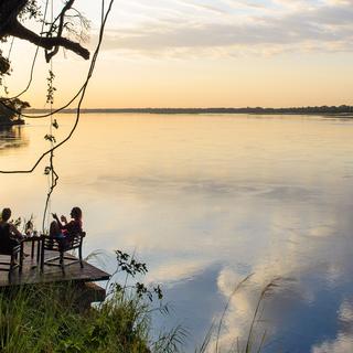 End your day in the bush off watching the sun set over the Zambezi River and its escarpment.