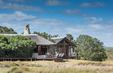 Lagoon Lodge built of stone and thatch from Mosaic.