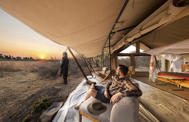 Kwihala - Guest enjoying sunset views from bedroom