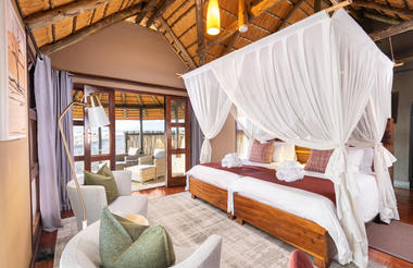 Luxury thatched, partly tented chalets with en-suite Bathrooms (indoor)