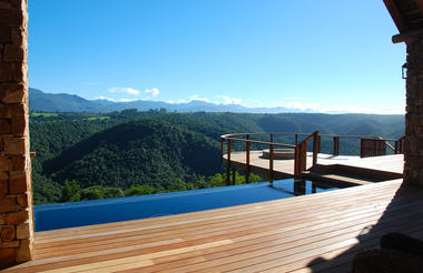 The lodge overlooks a magnificent indigenous forest and valley