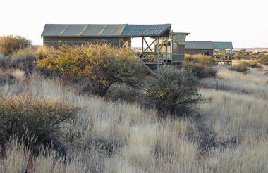 Six tent houses on the first western dune of the Kalahari