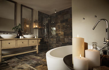 A luxurious en-suite bathroom with soaking tub and separate "rain" shower