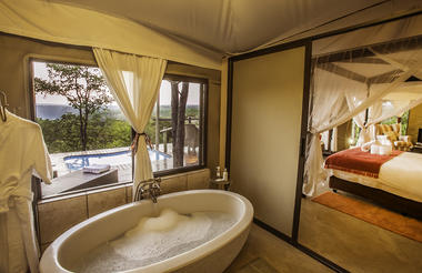 The Elephant Camp West - View from bathroom to room