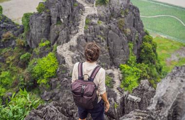 Man on top of pagoda of Hang Mua temple - Ninh Binh - Vietnam