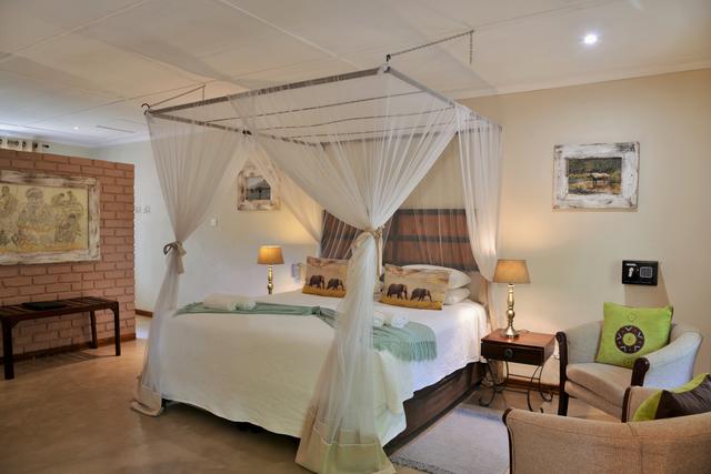 A spacious double bedded room with mosquito nets and an open plan screened large bathroom. There is an elegant Victorian Ball and Claw bath. There is a shower basin and toilet in the bathroom. This room type has an inter-leading options available