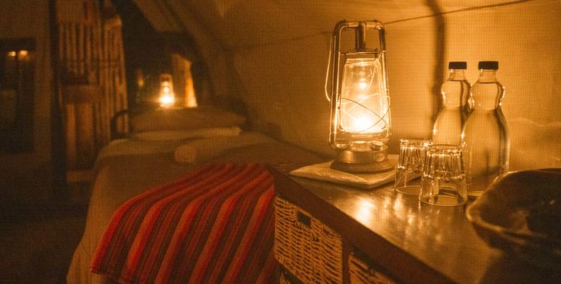 Cosy tent lit by lamp light