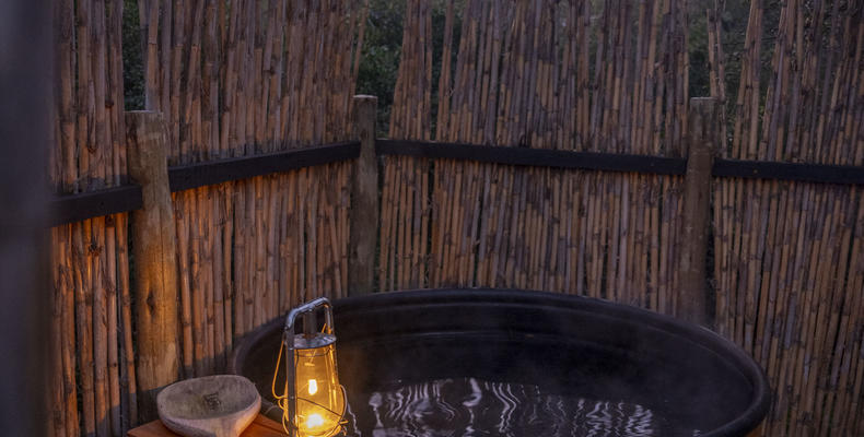 Wood-fired hot tub at each tent