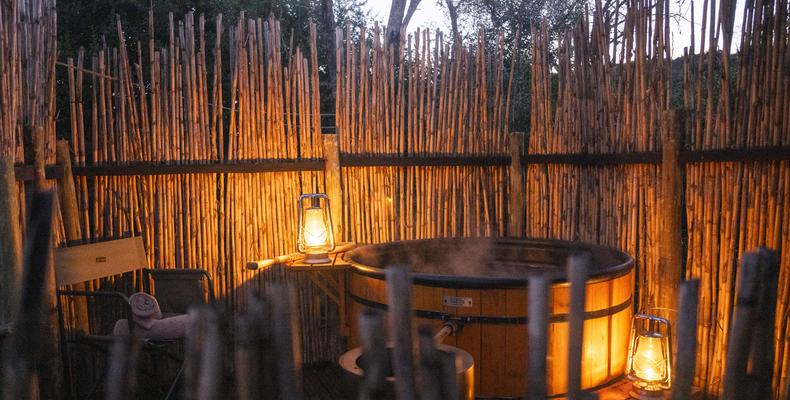 Wood-fired hot tub at each tent