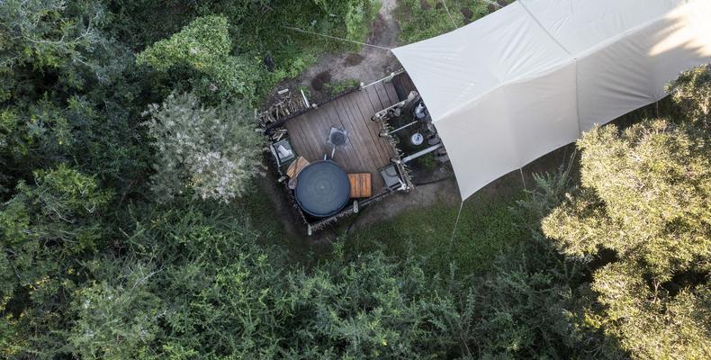 Private wood-fired hot tub at every tent